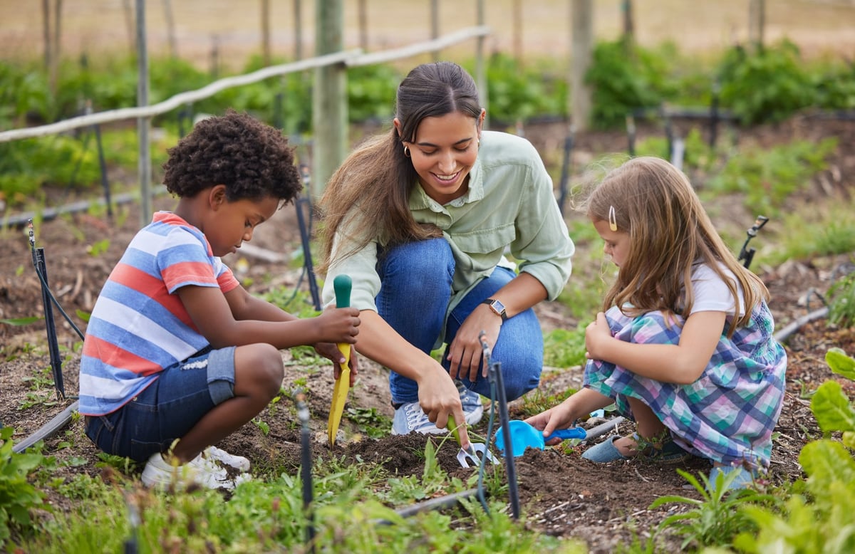 Teaching children about soil and gardening, hands in soil