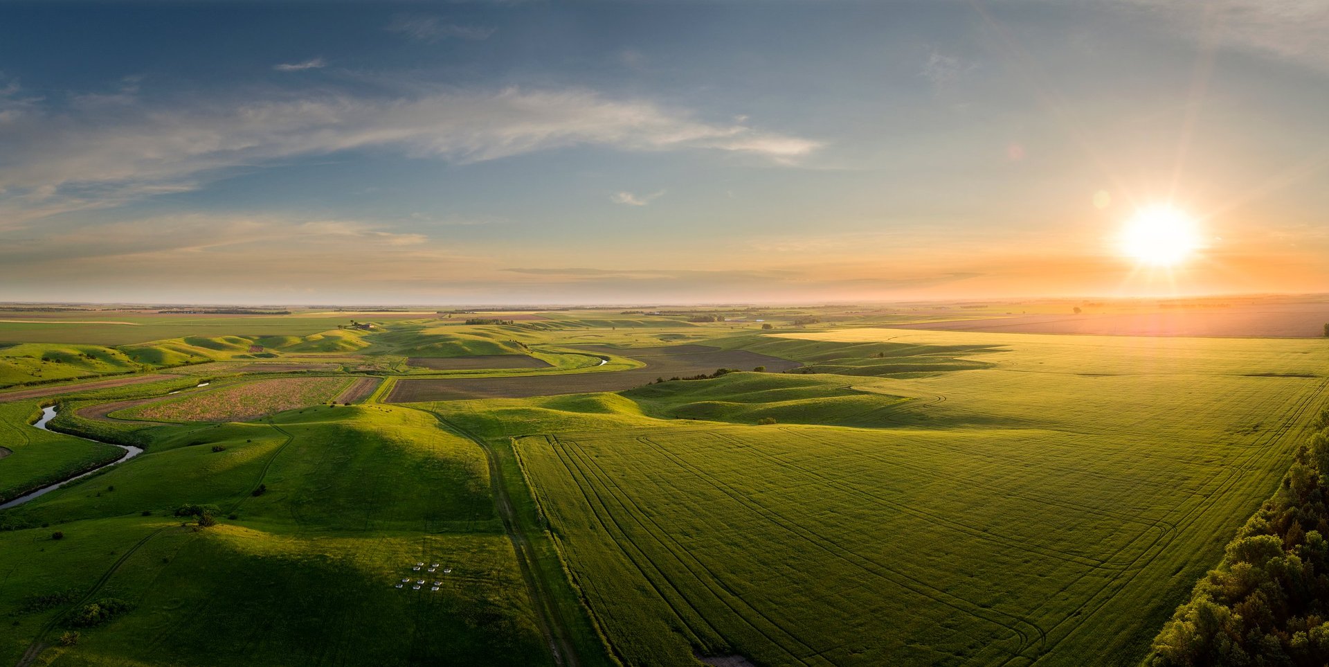 Early May aerial South Dakota panoramic sunrise over farm land