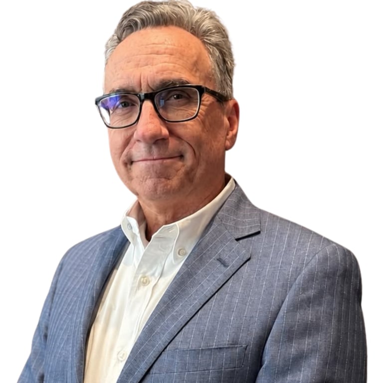 Middle-aged man wearing glasses and a gray pinstriped blazer with white dress shirt, smiling at camera against white background